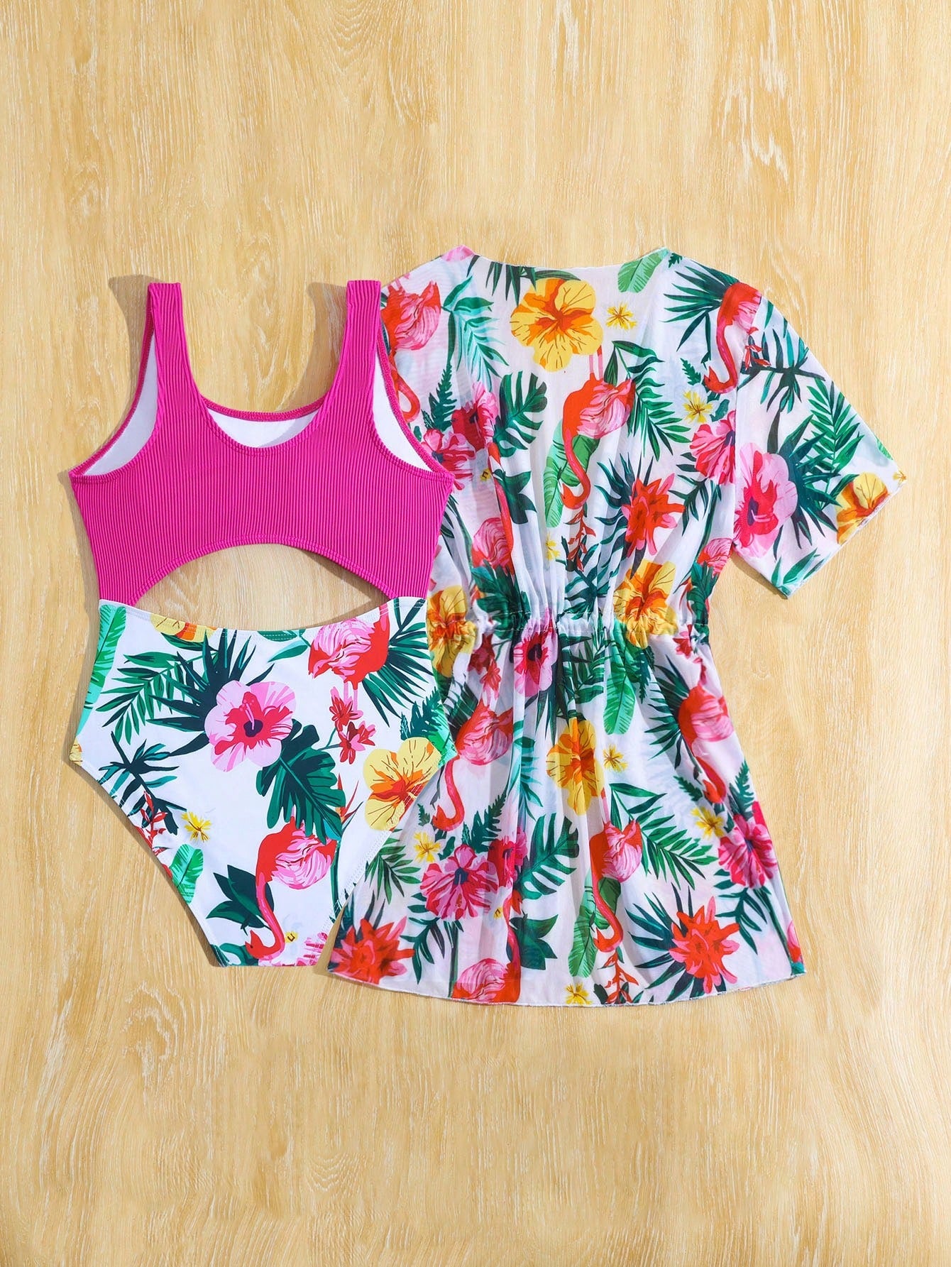 Tween girls multicolor 2-piece swimsuit set with scoop neck, cut-out details, patterned design, shorts-style bottoms, and sheer UV protection cover-up for beach and pool vacations.