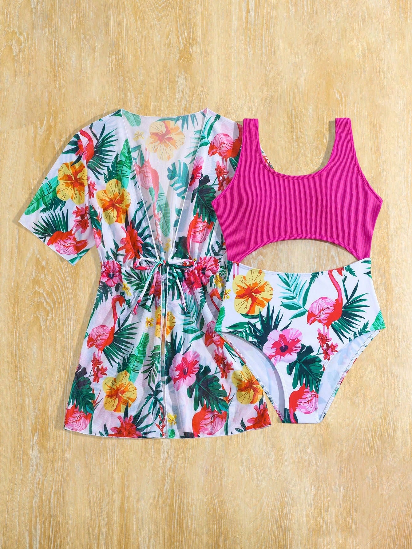 Tween girls multicolor 2-piece swimsuit set with scoop neck, cut-out details, patterned design, shorts-style bottoms, and sheer UV protection cover-up for beach and pool vacations.