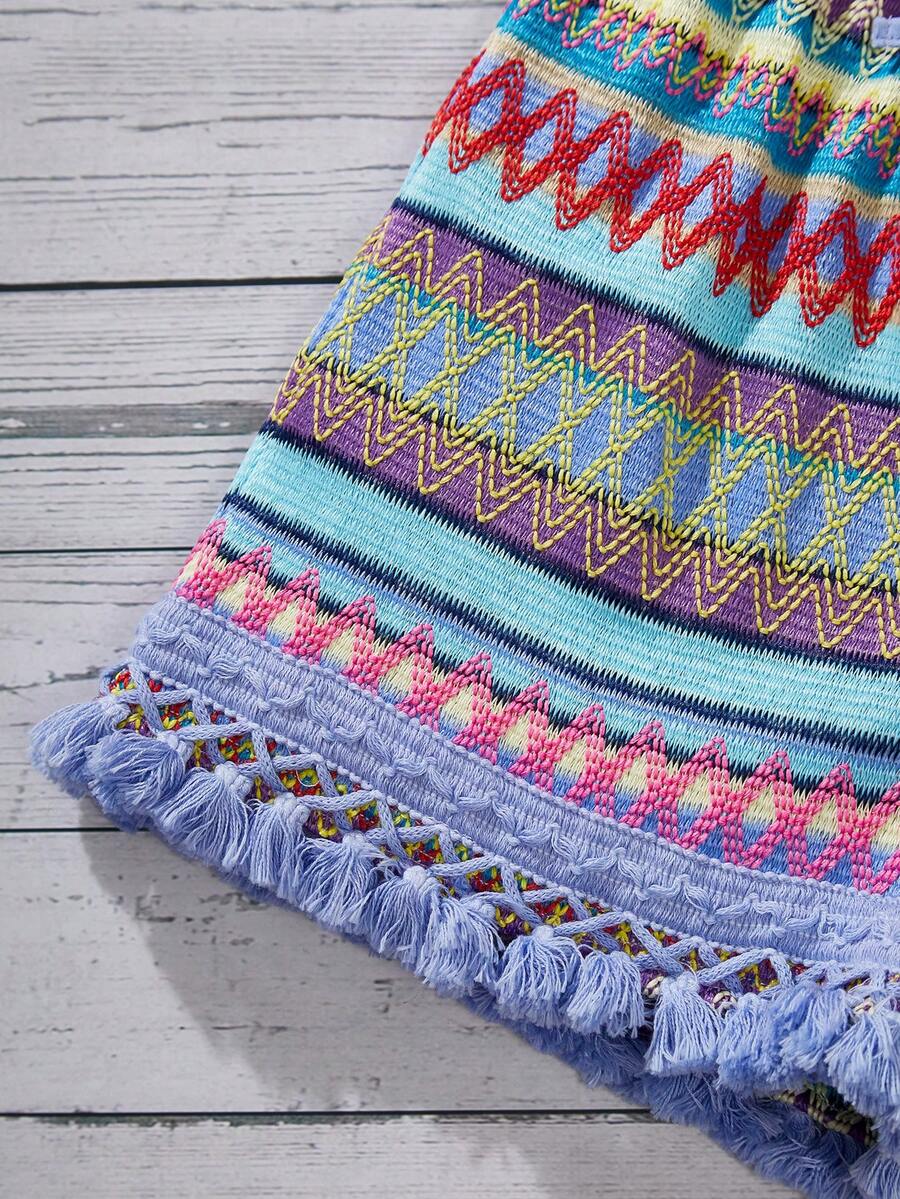 Tween girl wearing a blue boho sleeveless round neck tank top and matching printed shorts set with cable knit detailing.