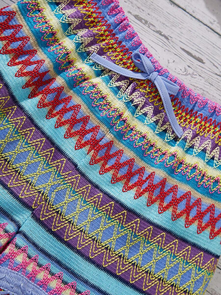 Tween girl wearing a blue boho sleeveless round neck tank top and matching printed shorts set with cable knit detailing.