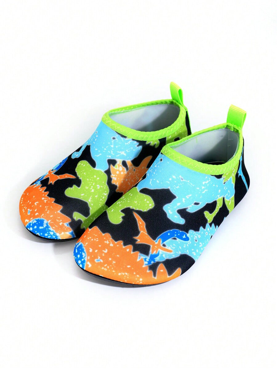 Multicolor cartoon pattern boys' aqua socks with breathable polyester upper, slip-on closure, and non-slip TPR outsole.