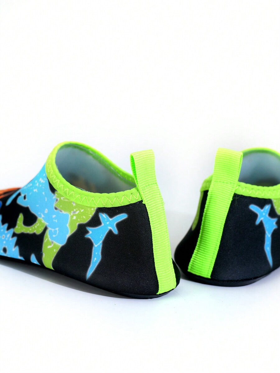 Multicolor cartoon pattern boys' aqua socks with breathable polyester upper, slip-on closure, and non-slip TPR outsole.