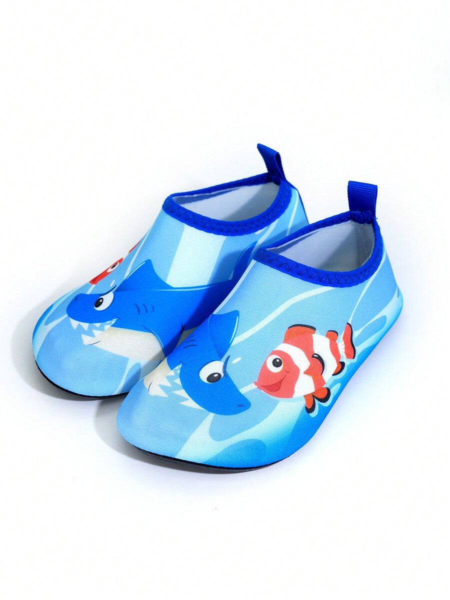 Multicolor cartoon pattern boys' aqua socks with breathable polyester upper, slip-on closure, and non-slip TPR outsole.