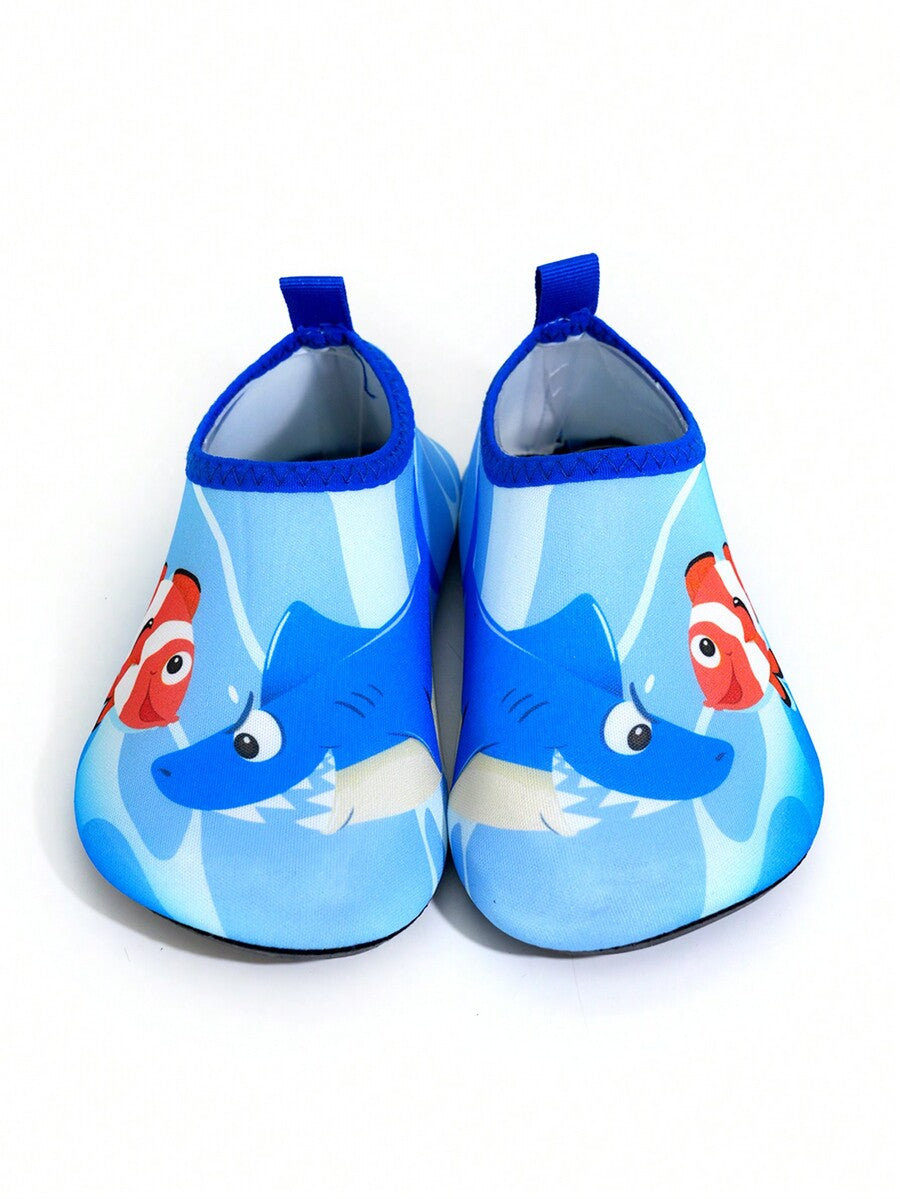 Multicolor cartoon pattern boys' aqua socks with breathable polyester upper, slip-on closure, and non-slip TPR outsole.
