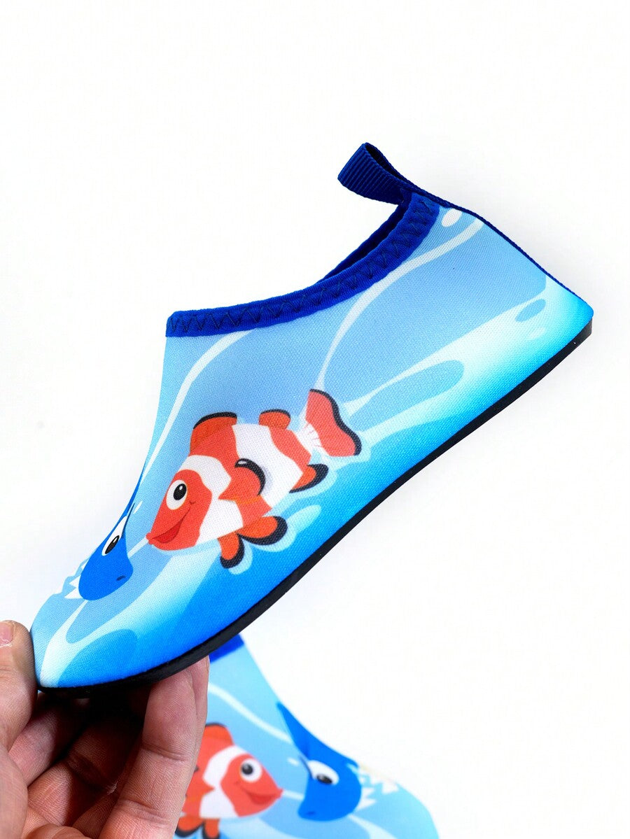 Multicolor cartoon pattern boys' aqua socks with breathable polyester upper, slip-on closure, and non-slip TPR outsole.