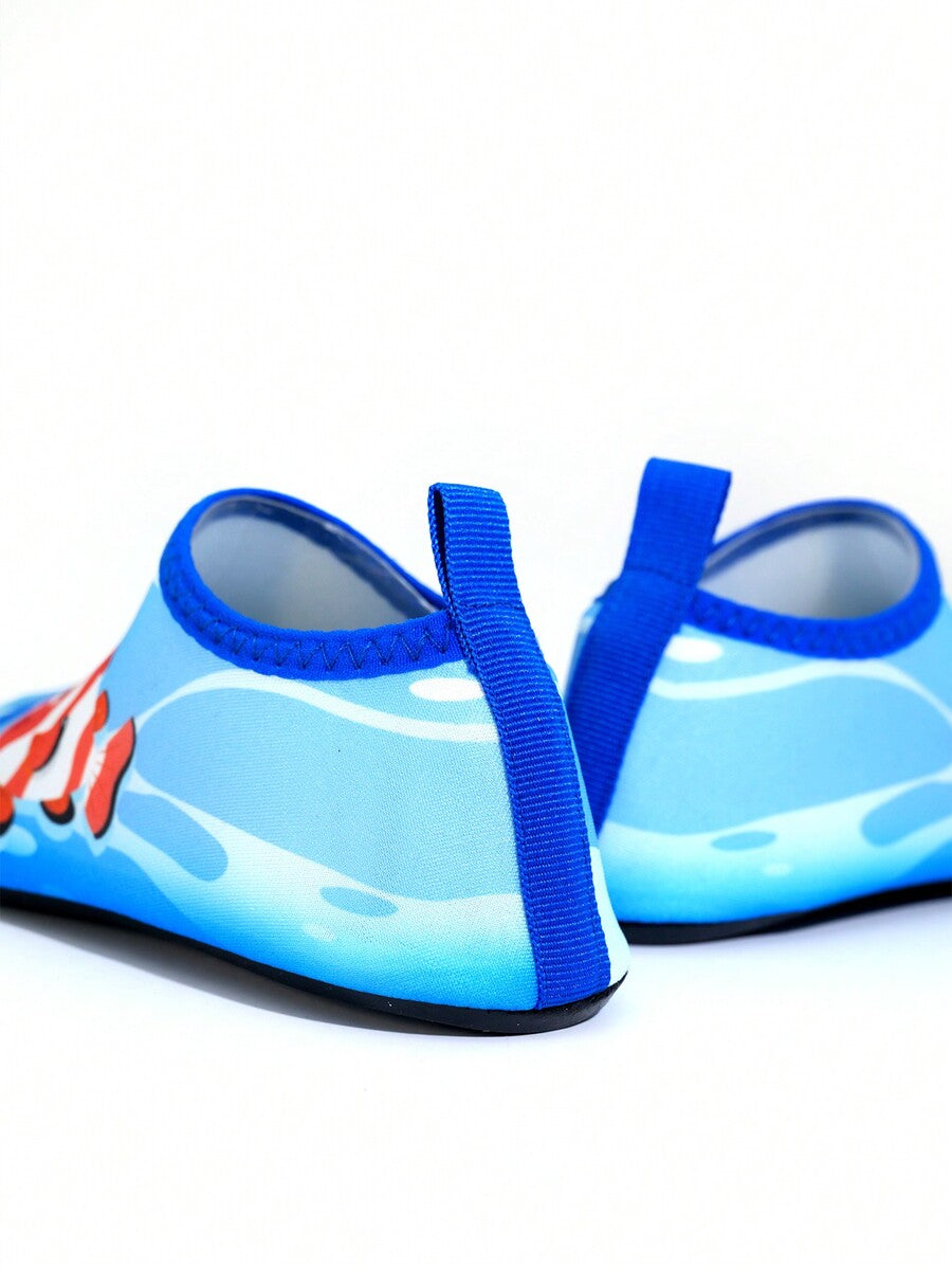 Multicolor cartoon pattern boys' aqua socks with breathable polyester upper, slip-on closure, and non-slip TPR outsole.