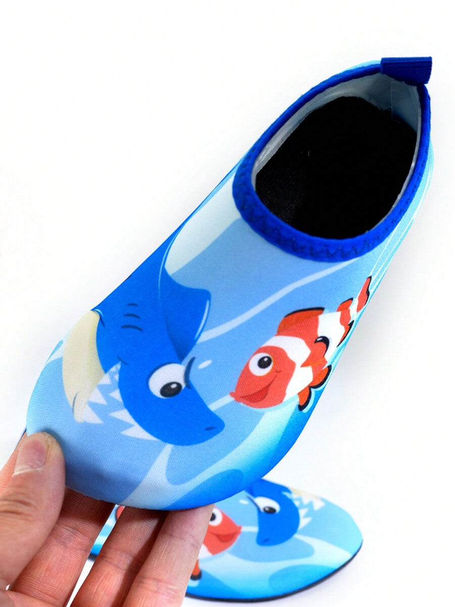 Multicolor cartoon pattern boys' aqua socks with breathable polyester upper, slip-on closure, and non-slip TPR outsole.