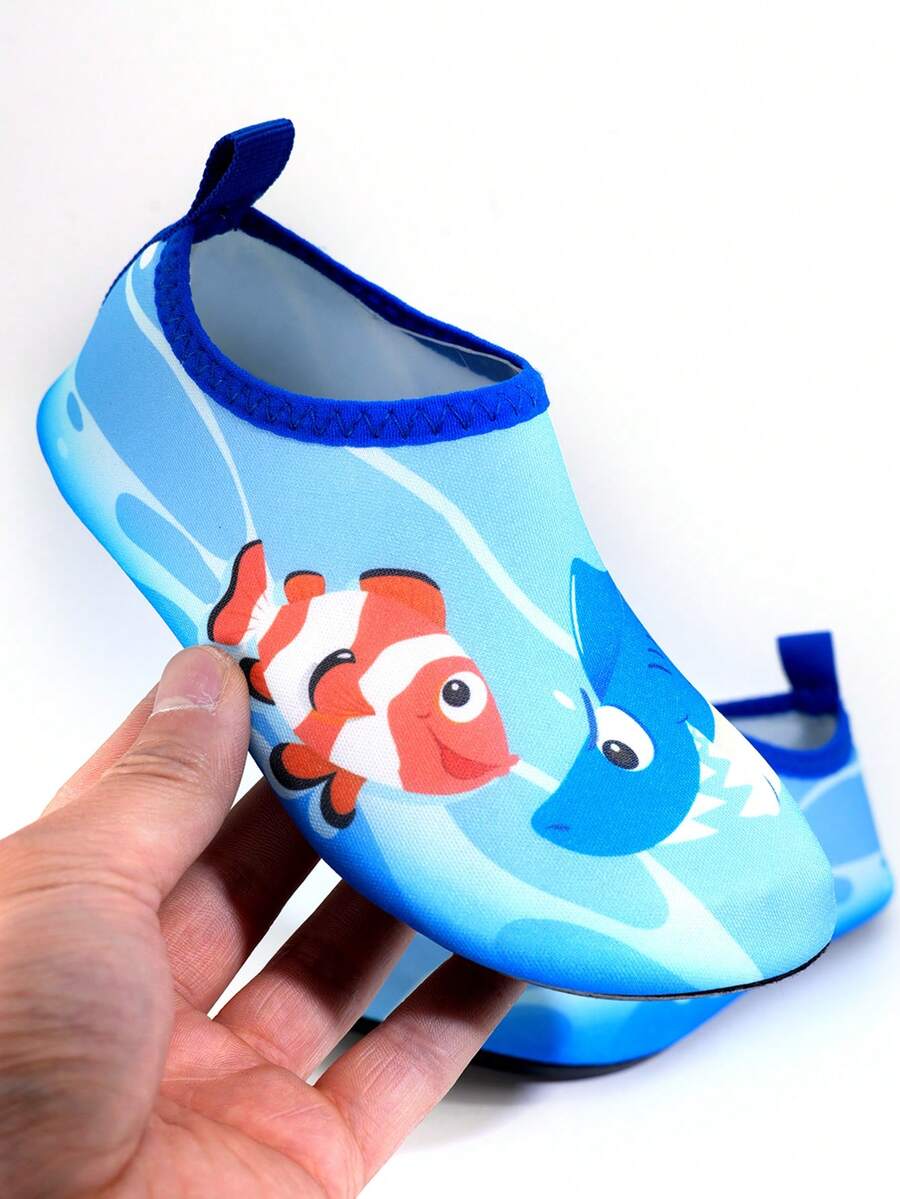 Multicolor cartoon pattern boys' aqua socks with breathable polyester upper, slip-on closure, and non-slip TPR outsole.