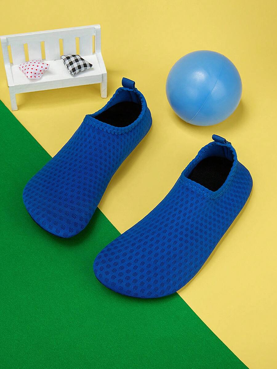Boys black plain aqua socks featuring a slip-on rib-knit design, breathable fabric upper, mesh insole, and non-slip TPR outsole.