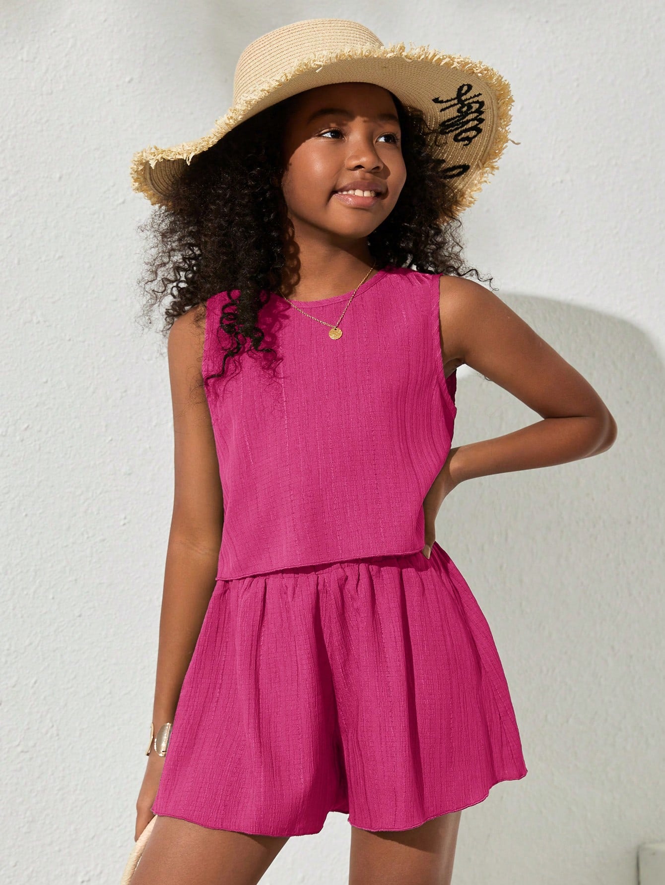 Tween girls army green casual outfit featuring a sleeveless round neck top with button details paired with matching woven loose shorts.