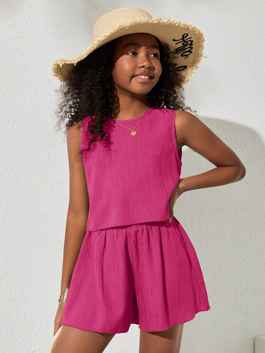 Tween girls army green casual outfit featuring a sleeveless round neck top with button details paired with matching woven loose shorts.
