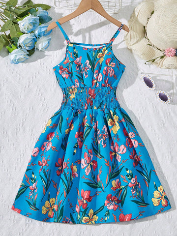 Tween girls floral mini dress with spaghetti straps, ruched shirred bodice, frill details, ruffle hem, high waist, and flared short silhouette for summer casual wear.