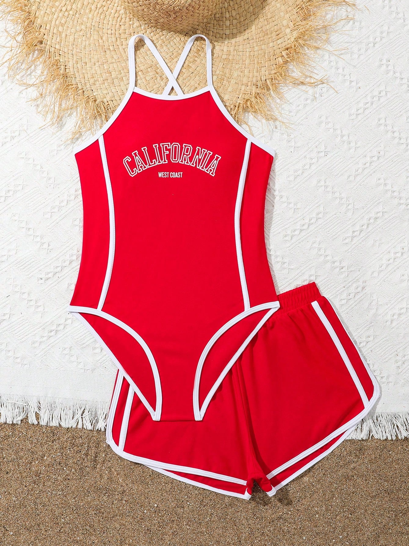 Girls' mauve purple one-piece swimsuit with swim shorts, spaghetti straps, contrast piping, letter pattern, and sleeveless vacation swimwear design.
