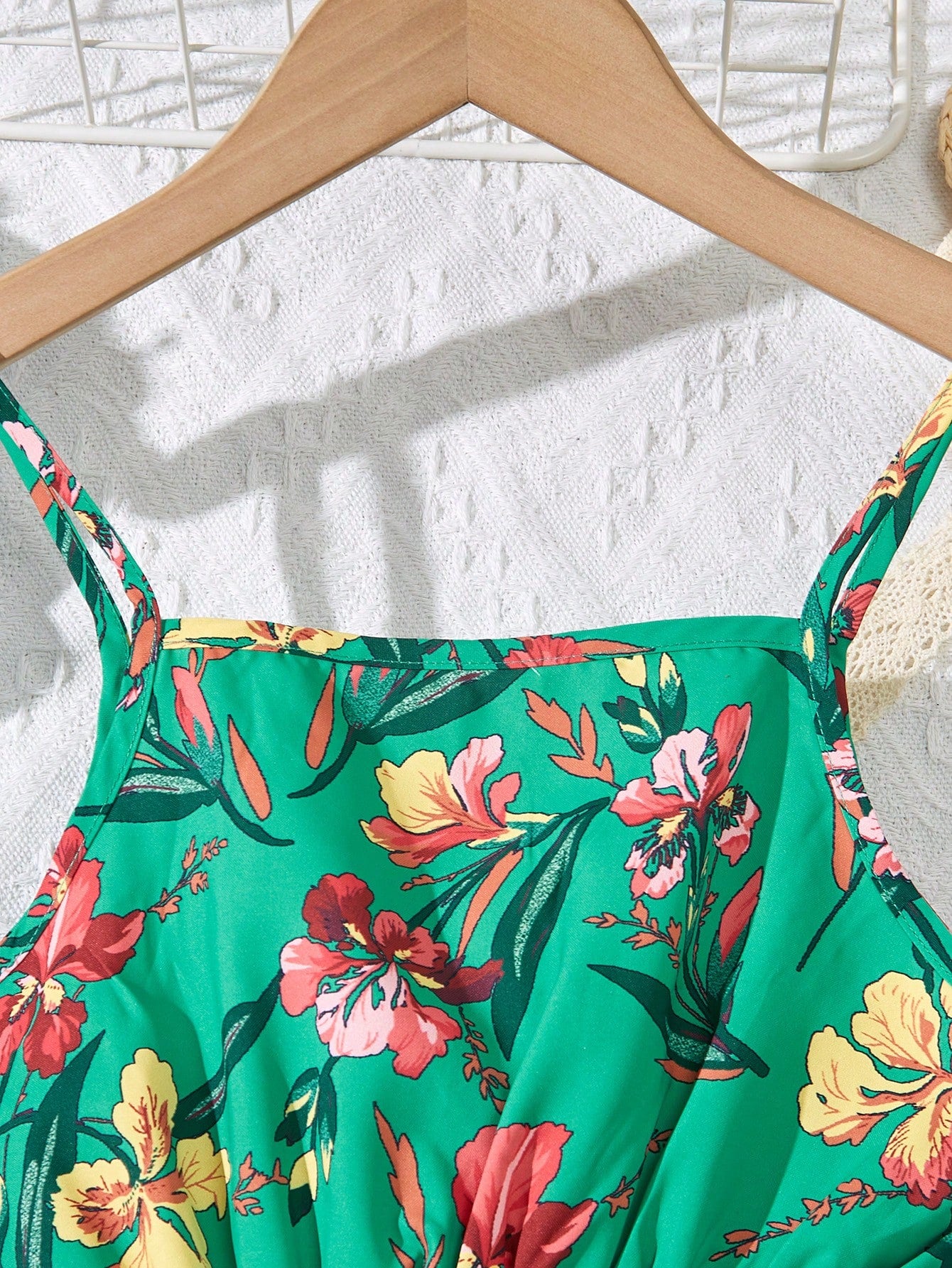 Tween girls floral mini dress with spaghetti straps, ruched shirred bodice, frill details, ruffle hem, high waist, and flared short silhouette for summer casual wear.