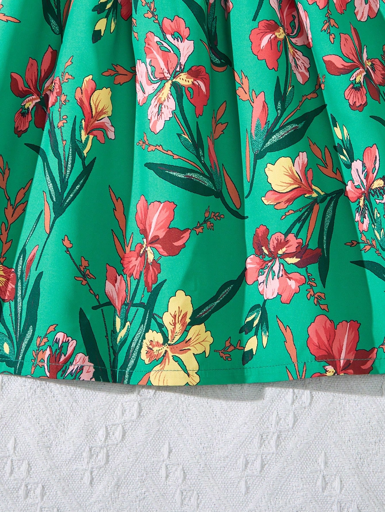 Tween girls floral mini dress with spaghetti straps, ruched shirred bodice, frill details, ruffle hem, high waist, and flared short silhouette for summer casual wear.