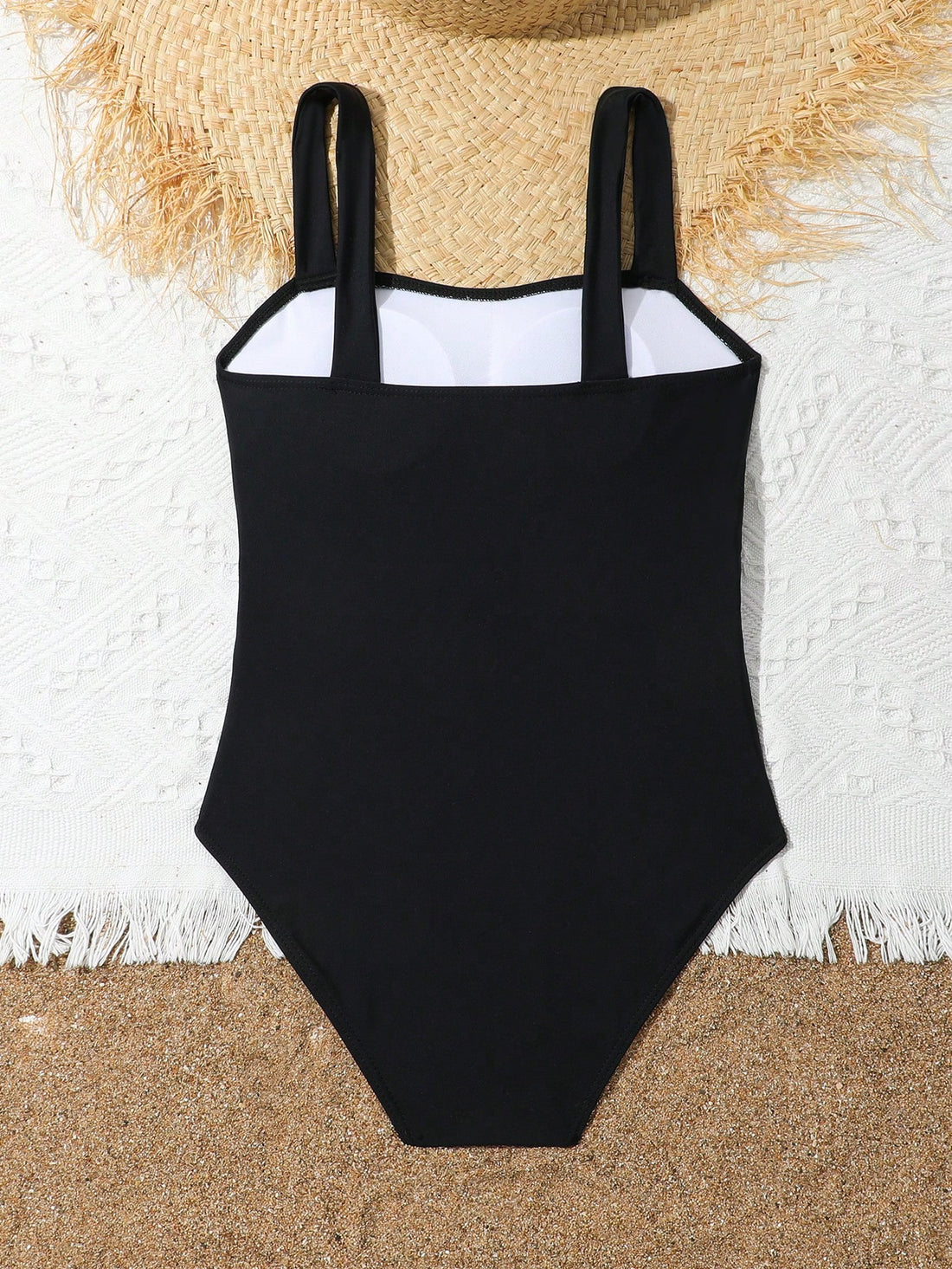 Tween girl multicolor ombre one-piece swimsuit with spaghetti straps, all-over print, lined body, and vacation beachwear style.