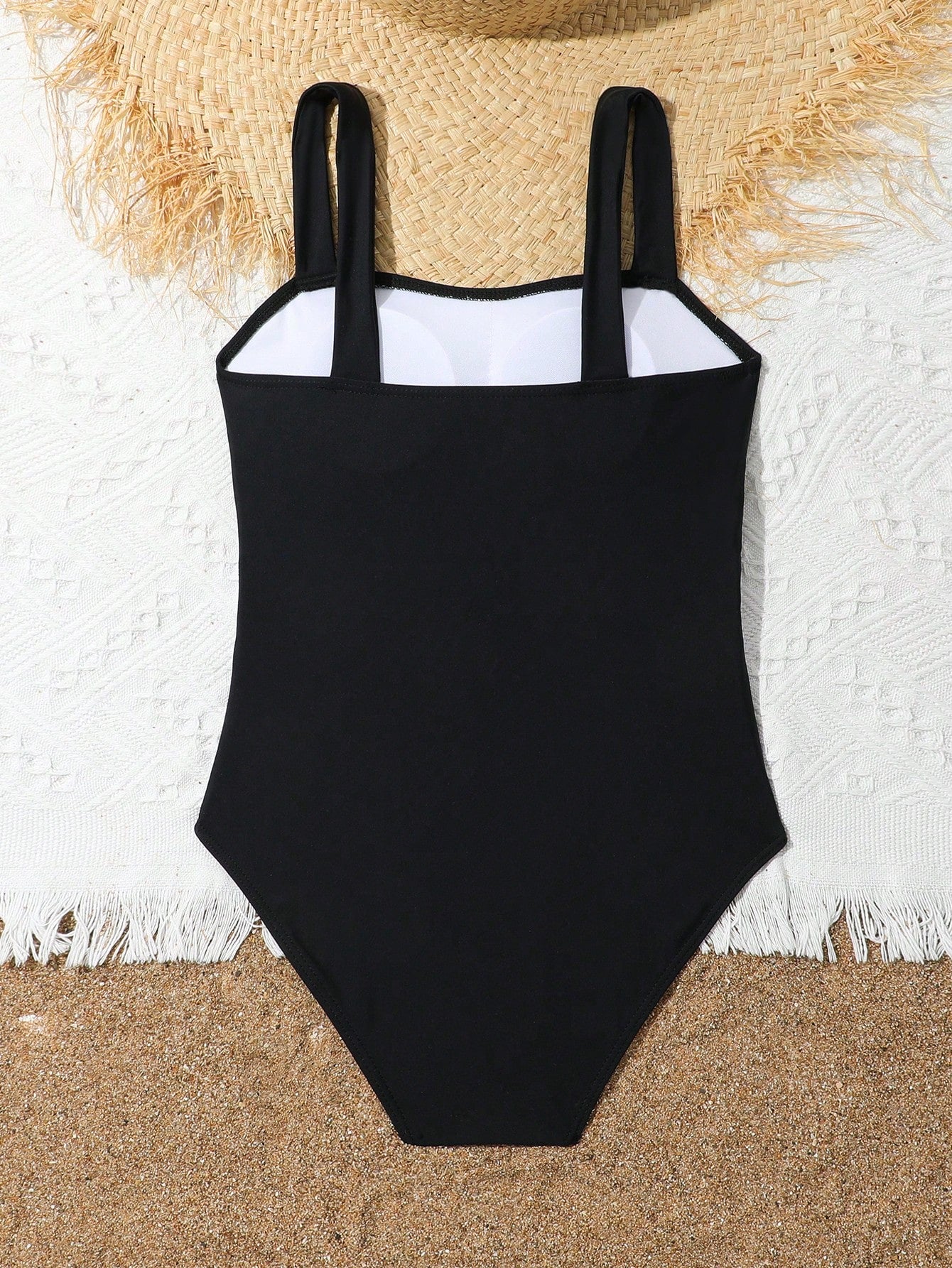 Tween girl multicolor ombre one-piece swimsuit with spaghetti straps, all-over print, lined body, and vacation beachwear style.