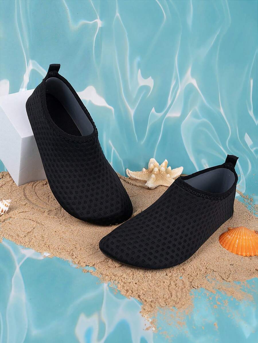 Boys black plain aqua socks featuring a slip-on rib-knit design, breathable fabric upper, mesh insole, and non-slip TPR outsole.