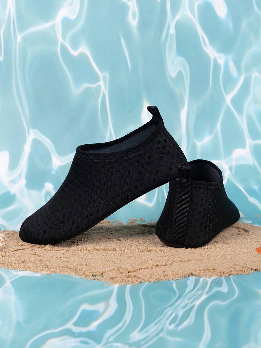 Boys black plain aqua socks featuring a slip-on rib-knit design, breathable fabric upper, mesh insole, and non-slip TPR outsole.