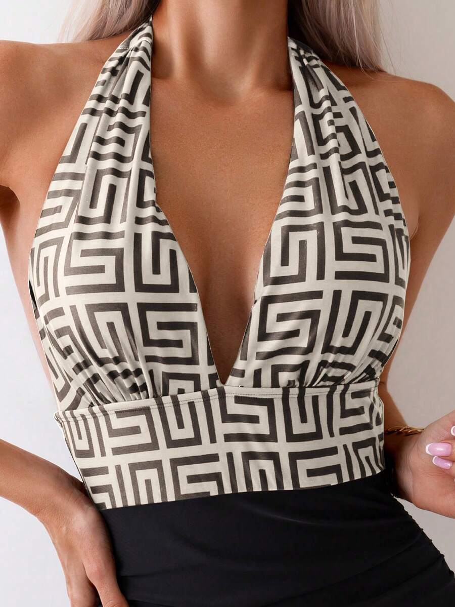 Apricot women's one-piece swimsuit featuring a halter neckline, backless tie-back detail, and ruched knitted fabric.
