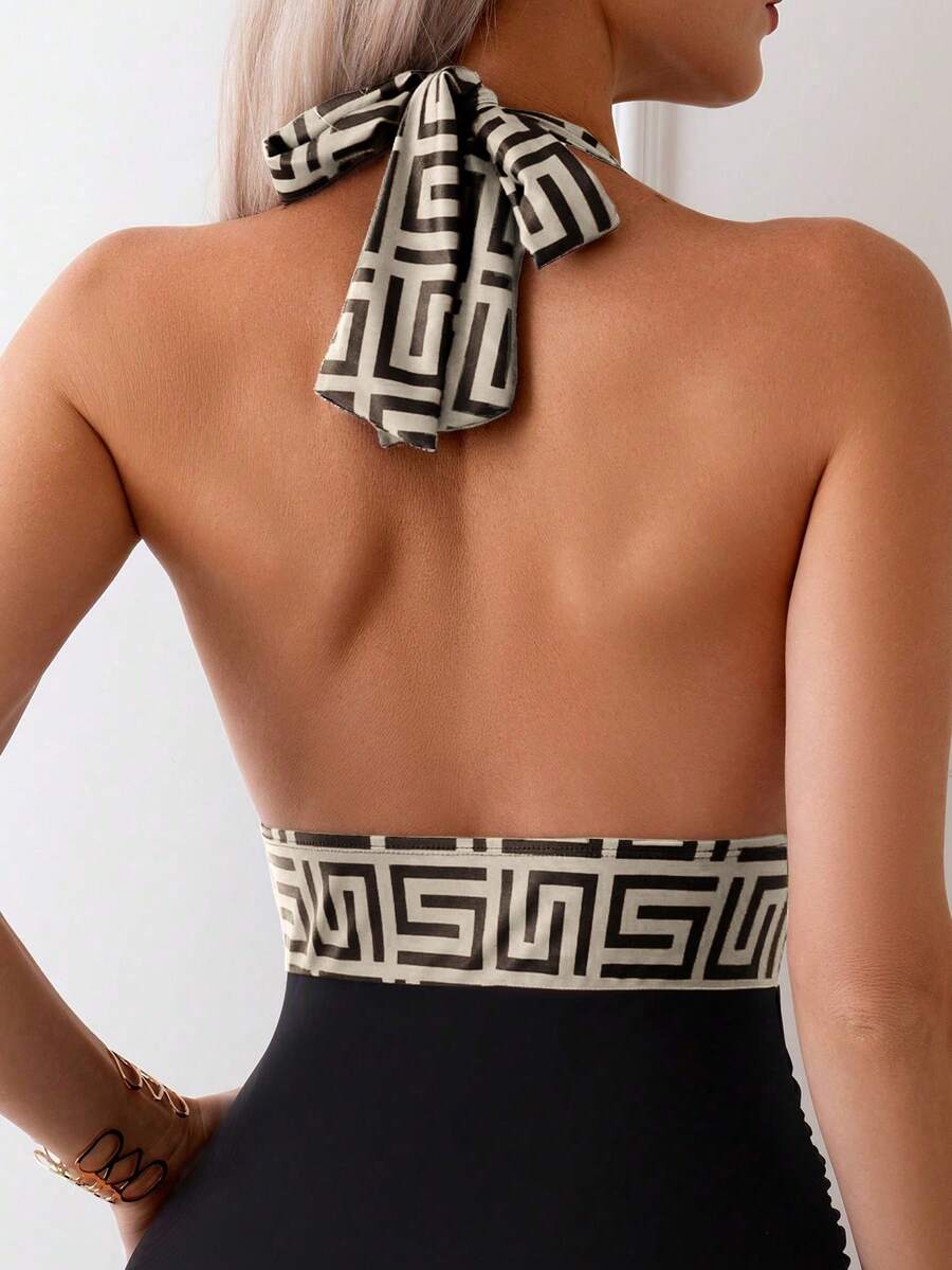 Apricot women's one-piece swimsuit featuring a halter neckline, backless tie-back detail, and ruched knitted fabric.