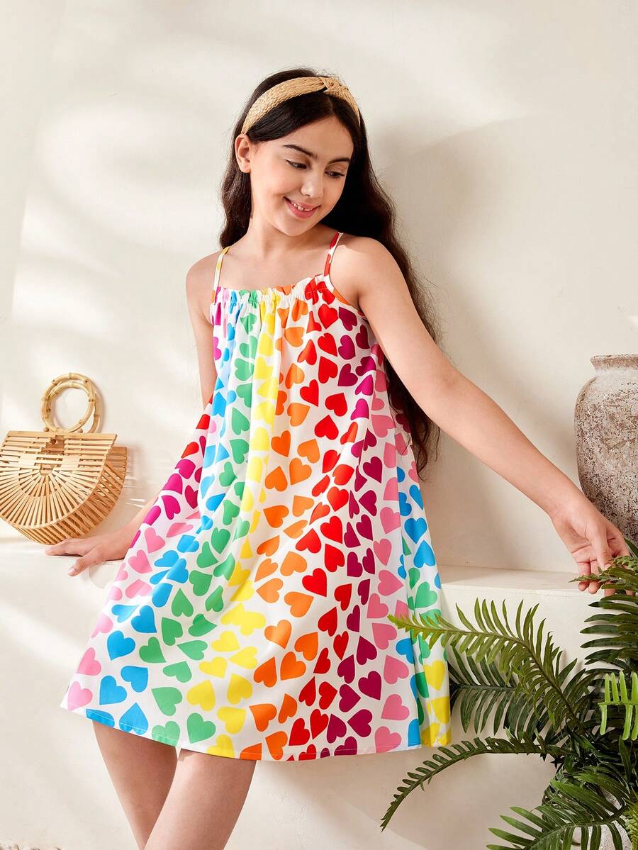 Multicolor geometric print cami midi dress for tween girls featuring spaghetti straps and a flared hem.