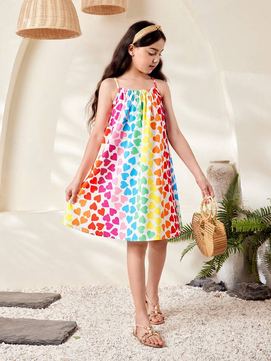 Multicolor geometric print cami midi dress for tween girls featuring spaghetti straps and a flared hem.