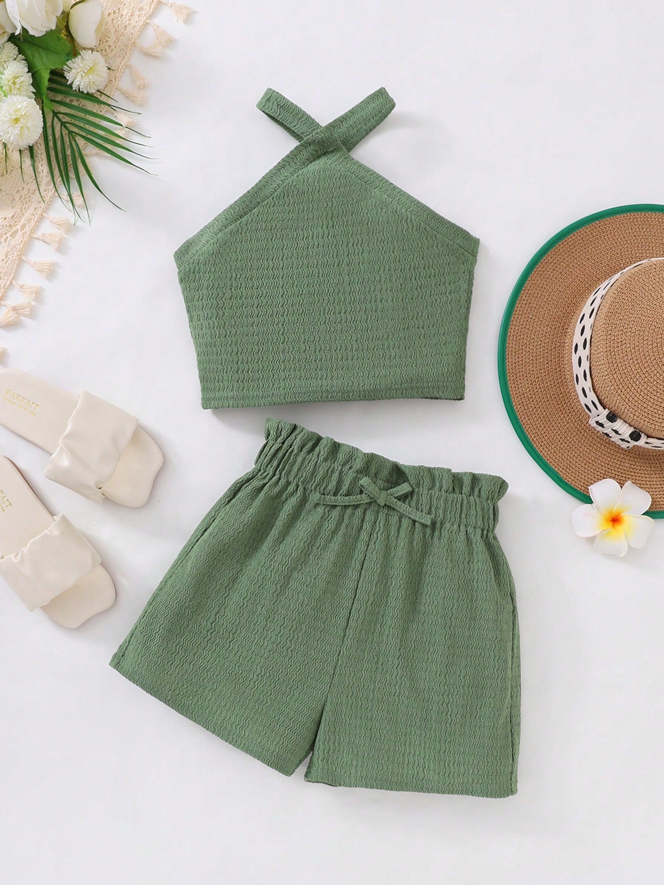 Tween girl 2-piece casual outfit set featuring a solid beige knit halter sleeveless top with belted detail and matching shorts.