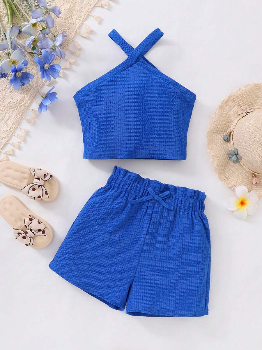 Tween girl 2-piece casual outfit set featuring a solid beige knit halter sleeveless top with belted detail and matching shorts.