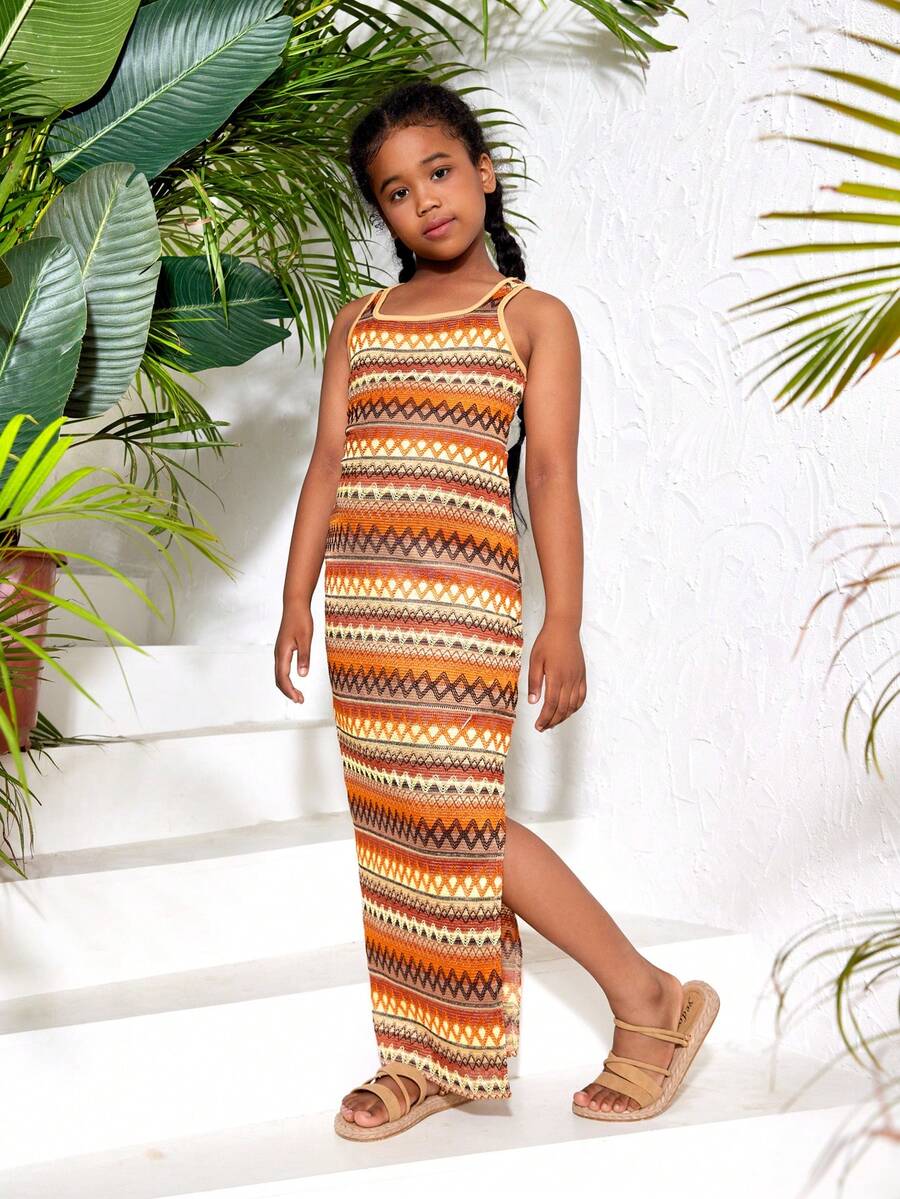 Tween girls sleeveless ditsy floral tank dress featuring a round neckline, slim fit silhouette, and side split hem.