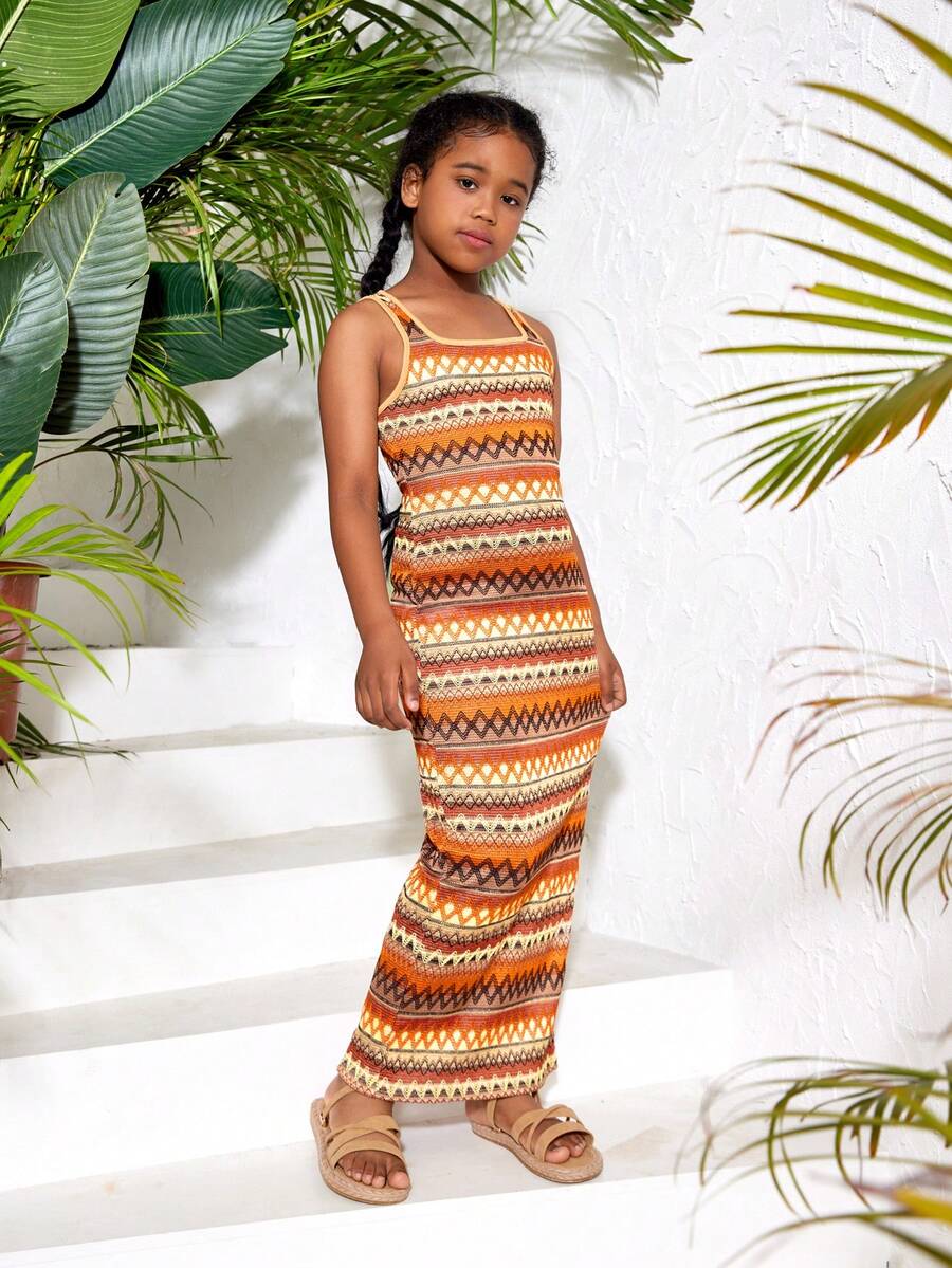 Tween girls sleeveless ditsy floral tank dress featuring a round neckline, slim fit silhouette, and side split hem.