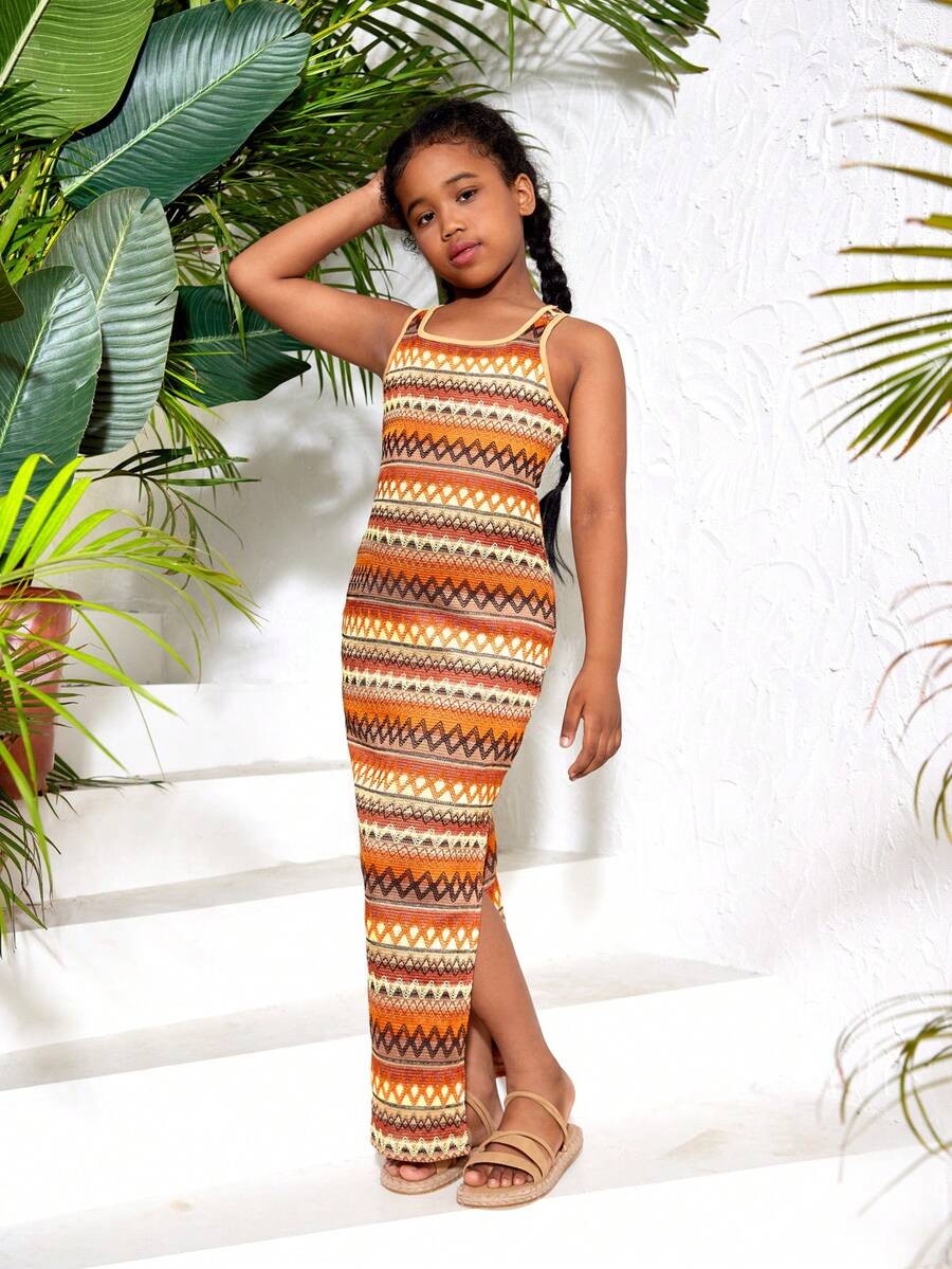 Tween girls sleeveless ditsy floral tank dress featuring a round neckline, slim fit silhouette, and side split hem.