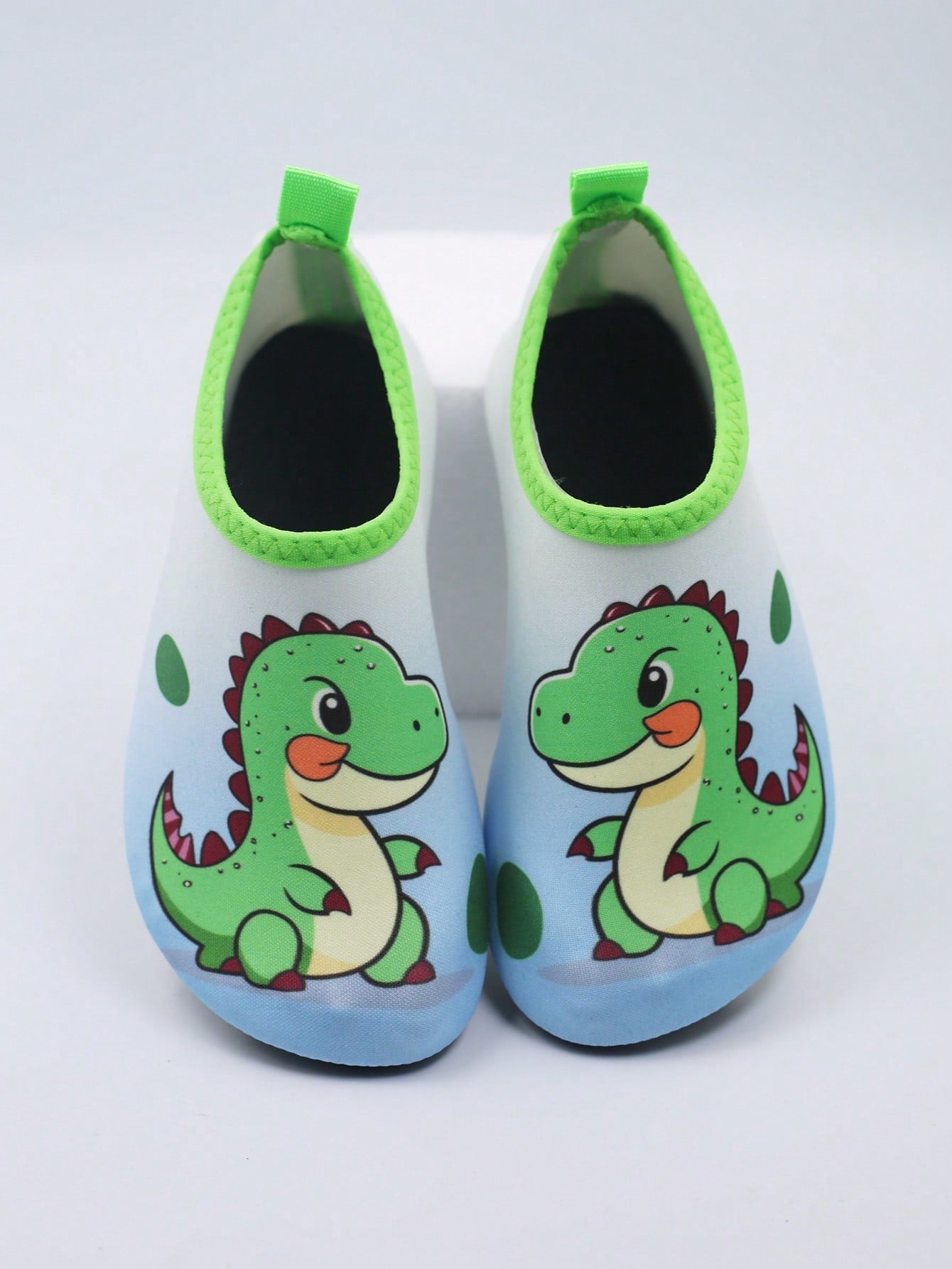 Multicolor kids slip-on water shoes with breathable Lycra upper and non-slip TPR outsole for boys and girls.