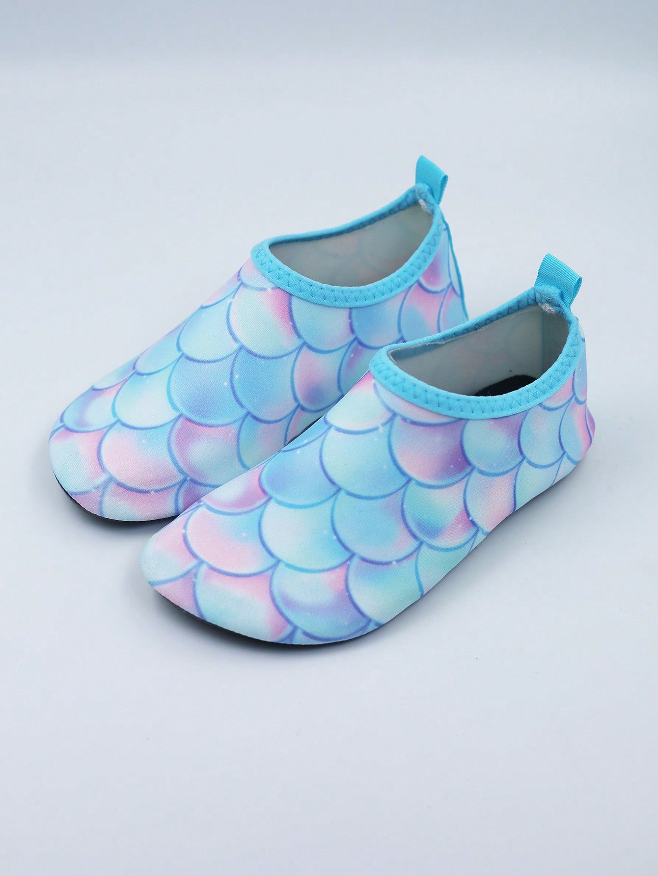 Multicolor kids slip-on water shoes with breathable Lycra upper and non-slip TPR outsole for boys and girls.