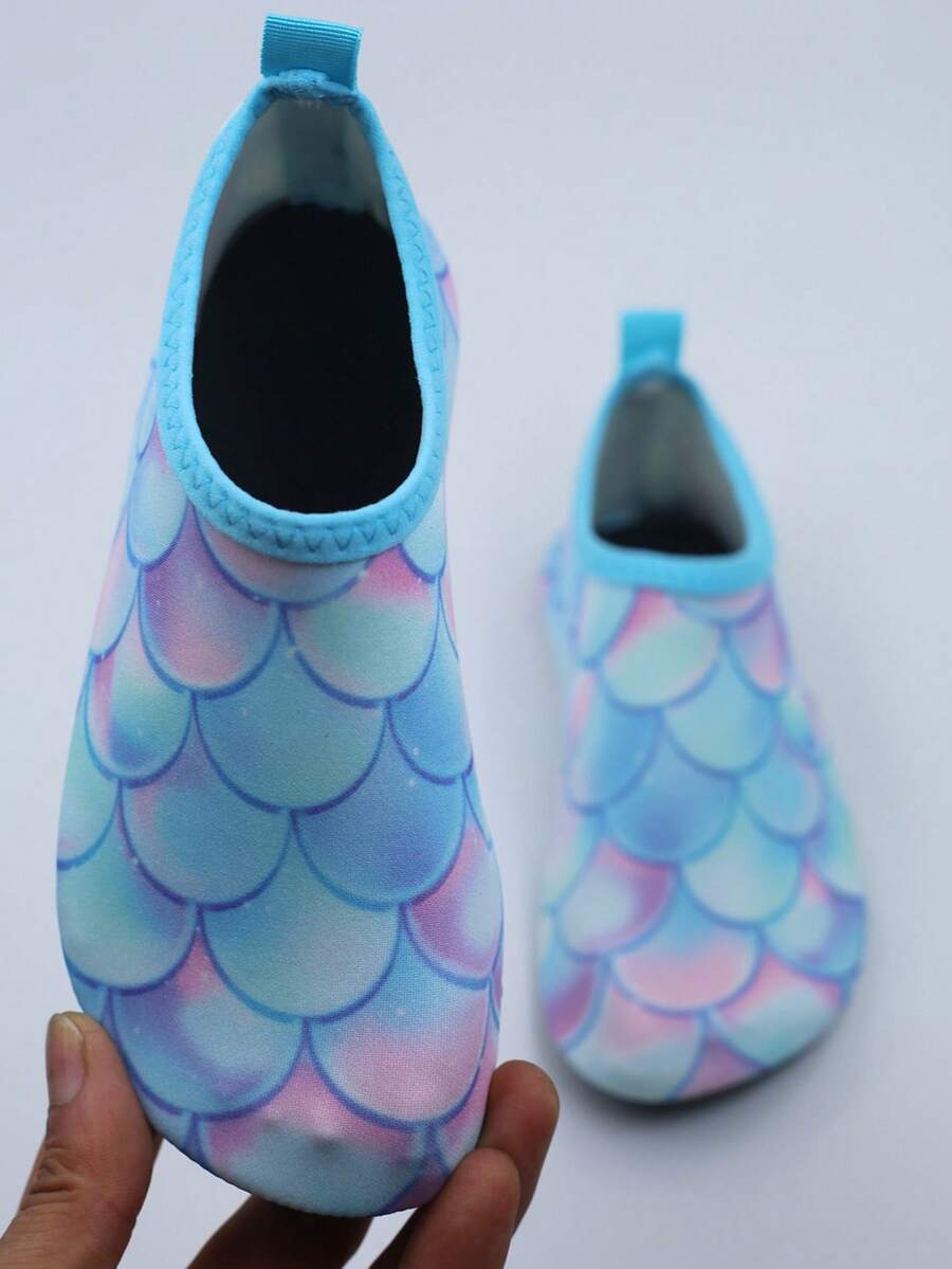 Multicolor kids slip-on water shoes with breathable Lycra upper and non-slip TPR outsole for boys and girls.