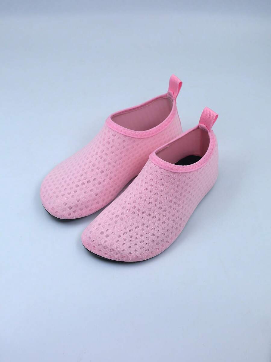 Kids slip-on aqua socks featuring geometric pattern, breathable Lycra upper, and non-slip TPR outsole for beach and water activities.