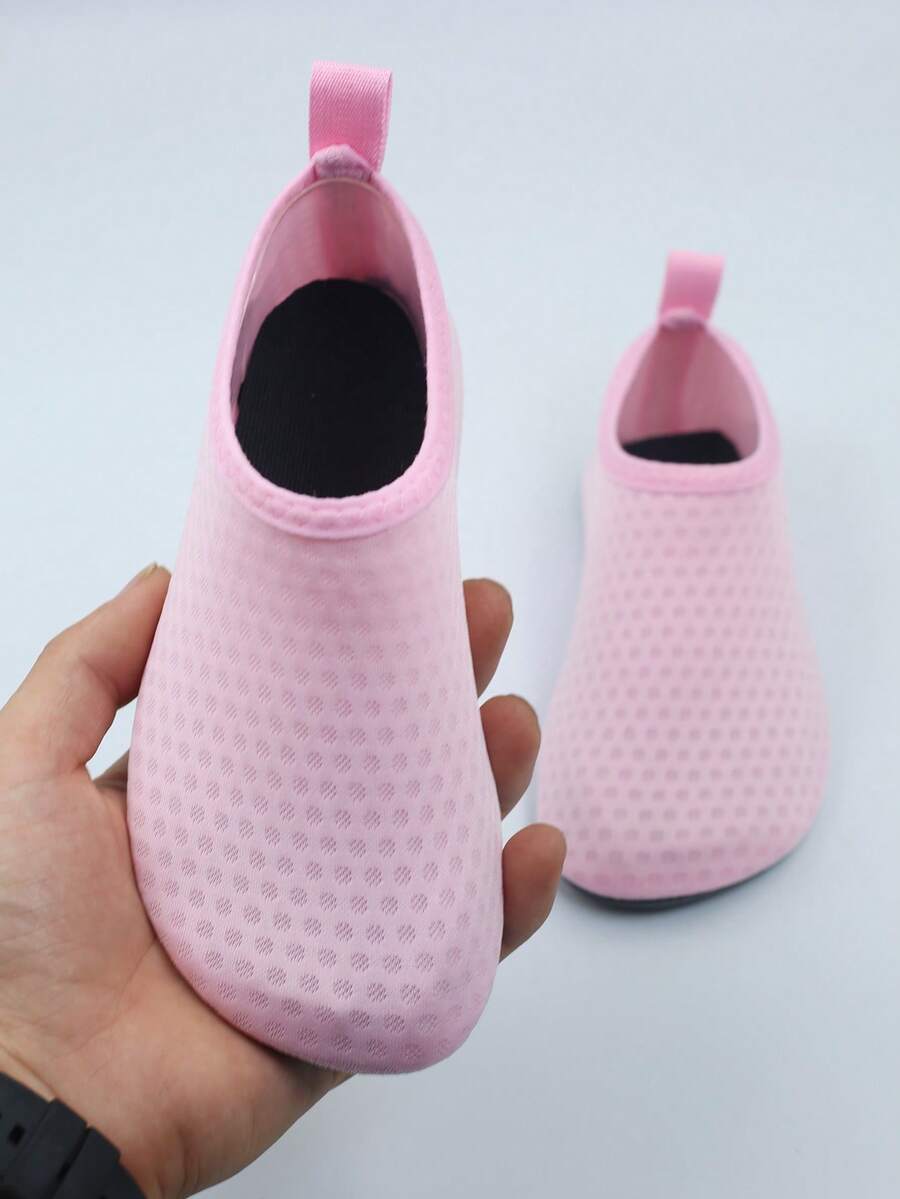 Kids slip-on aqua socks featuring geometric pattern, breathable Lycra upper, and non-slip TPR outsole for beach and water activities.
