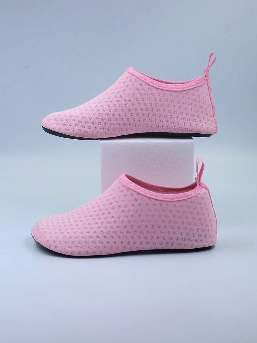 Kids slip-on aqua socks featuring geometric pattern, breathable Lycra upper, and non-slip TPR outsole for beach and water activities.