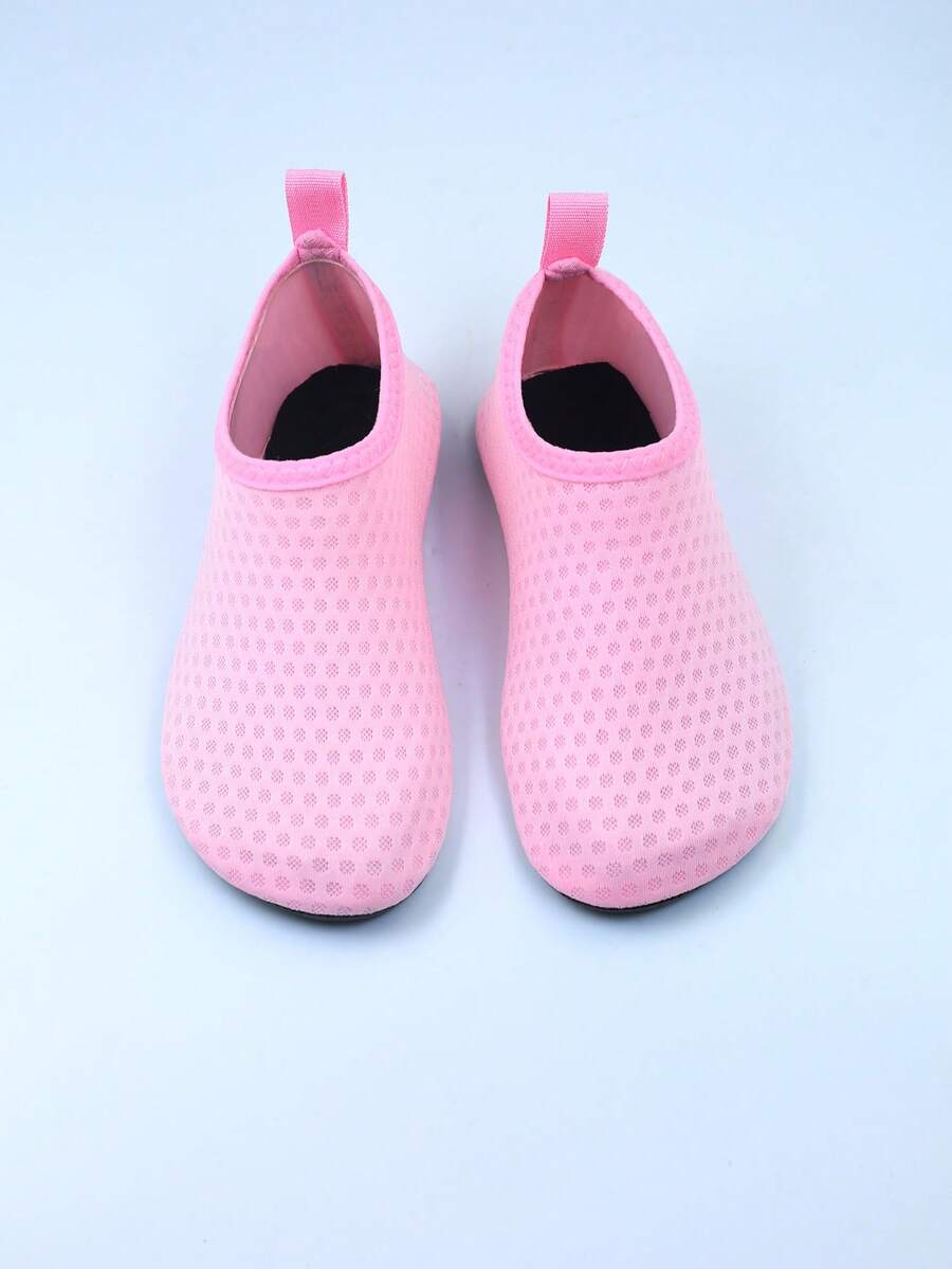Kids slip-on aqua socks featuring geometric pattern, breathable Lycra upper, and non-slip TPR outsole for beach and water activities.