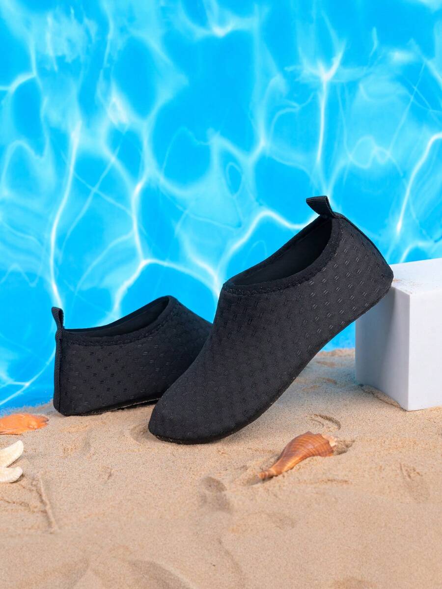 Boys black plain aqua socks featuring a slip-on rib-knit design, breathable fabric upper, mesh insole, and non-slip TPR outsole.