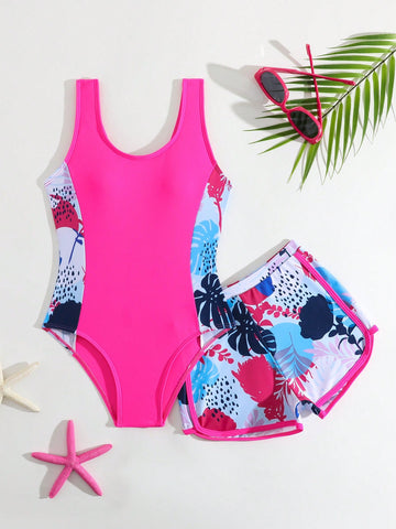 Tween girls 2-piece swimsuit set with a printed one-piece featuring ruffle trim, scoop neckline, cut-out detail, and matching shorts bottom.
