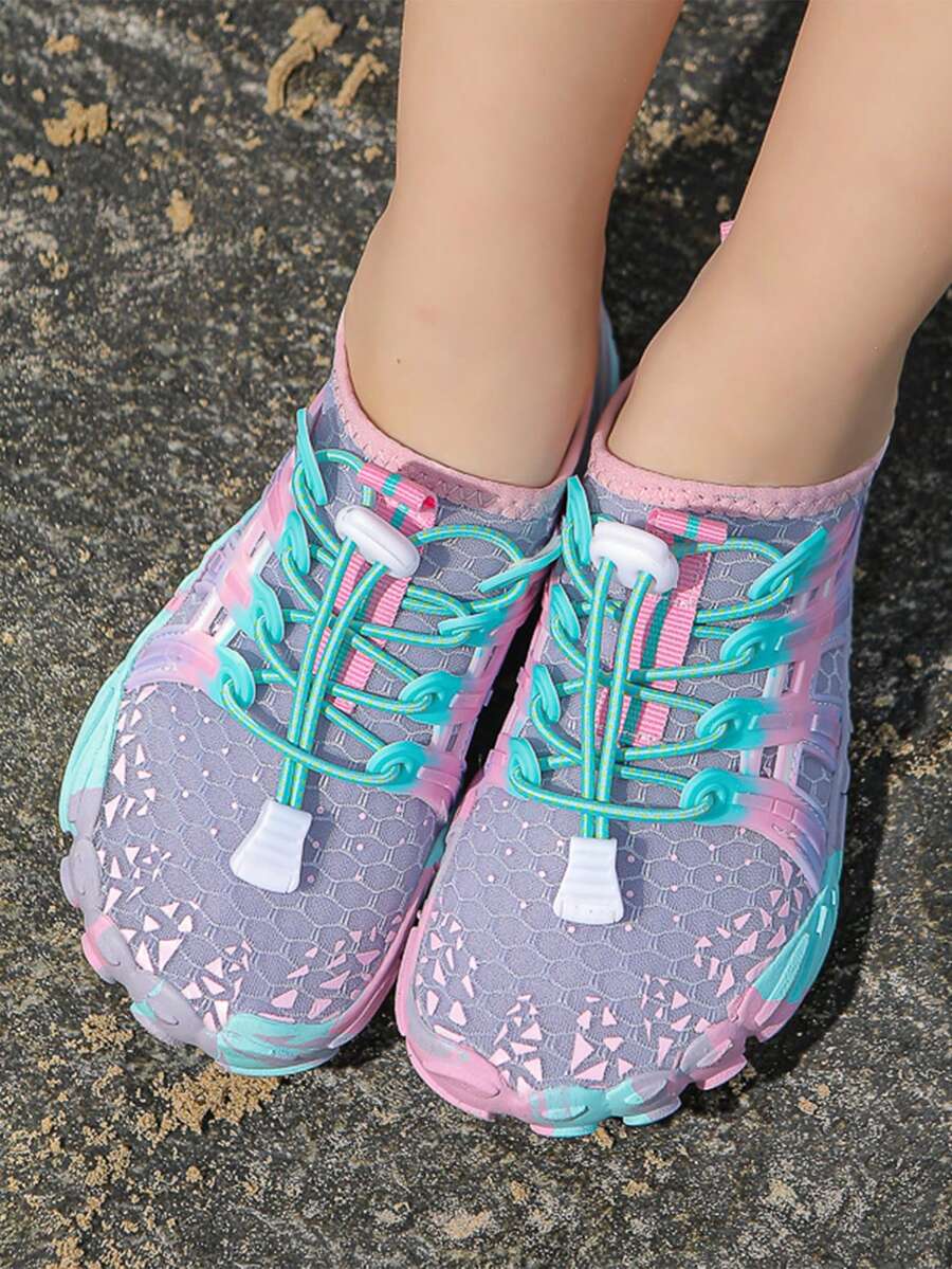 Girls purple quick-drying water shoes featuring a geometric pattern, slip-on fit with lace-up detail, and rubber outsole.