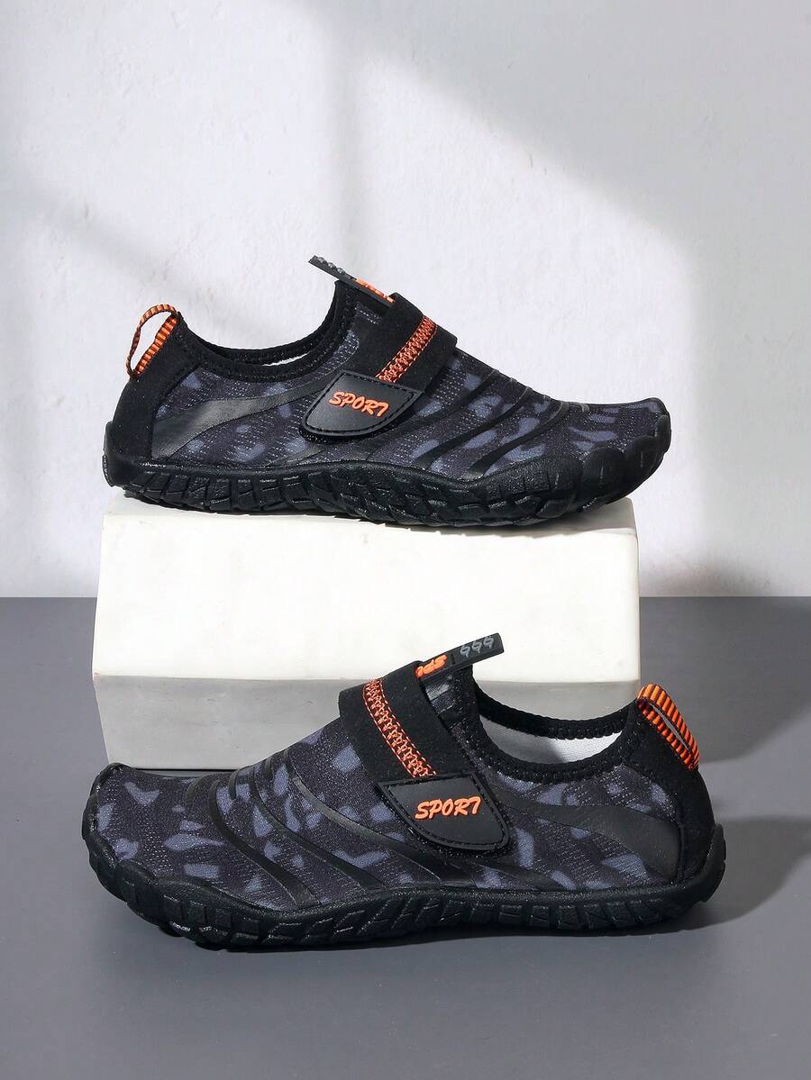 Boys green floral pattern lightweight mesh water shoes with non-slip rubber outsole and hook loop closure.