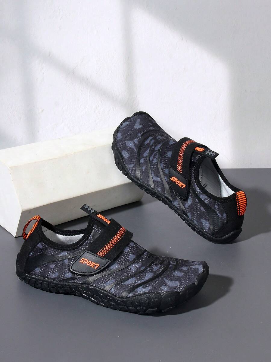 Boys green floral pattern lightweight mesh water shoes with non-slip rubber outsole and hook loop closure.