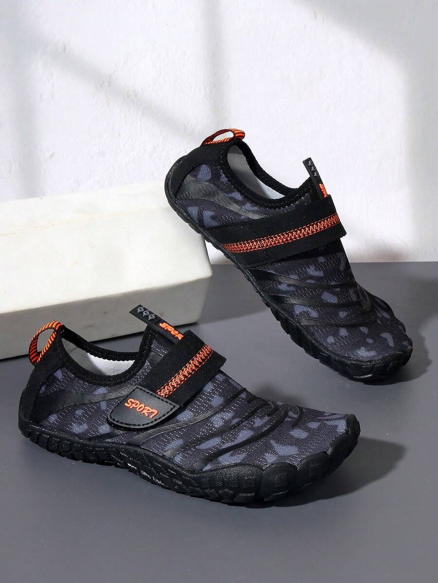 Boys green floral pattern lightweight mesh water shoes with non-slip rubber outsole and hook loop closure.