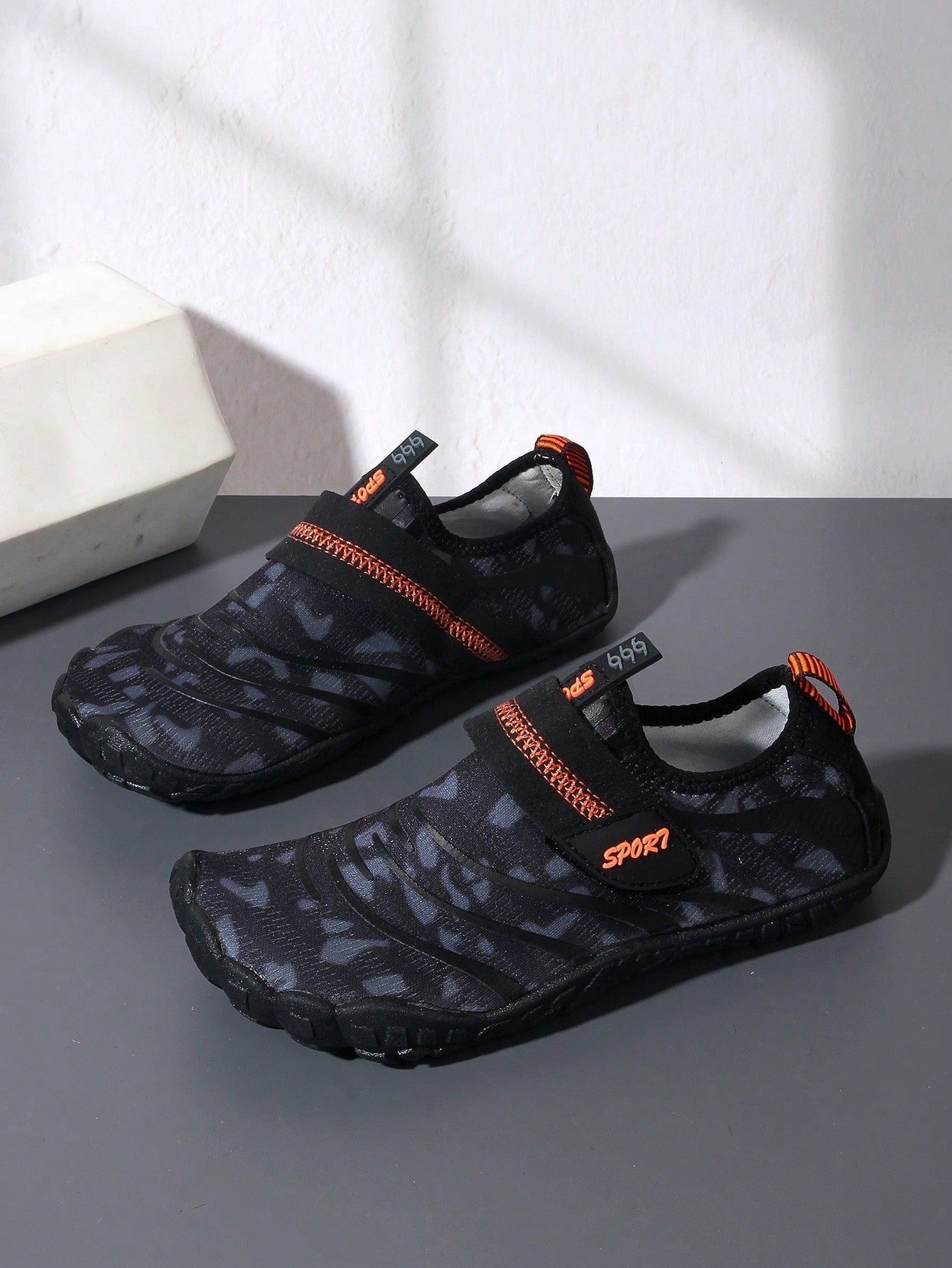 Boys green floral pattern lightweight mesh water shoes with non-slip rubber outsole and hook loop closure.