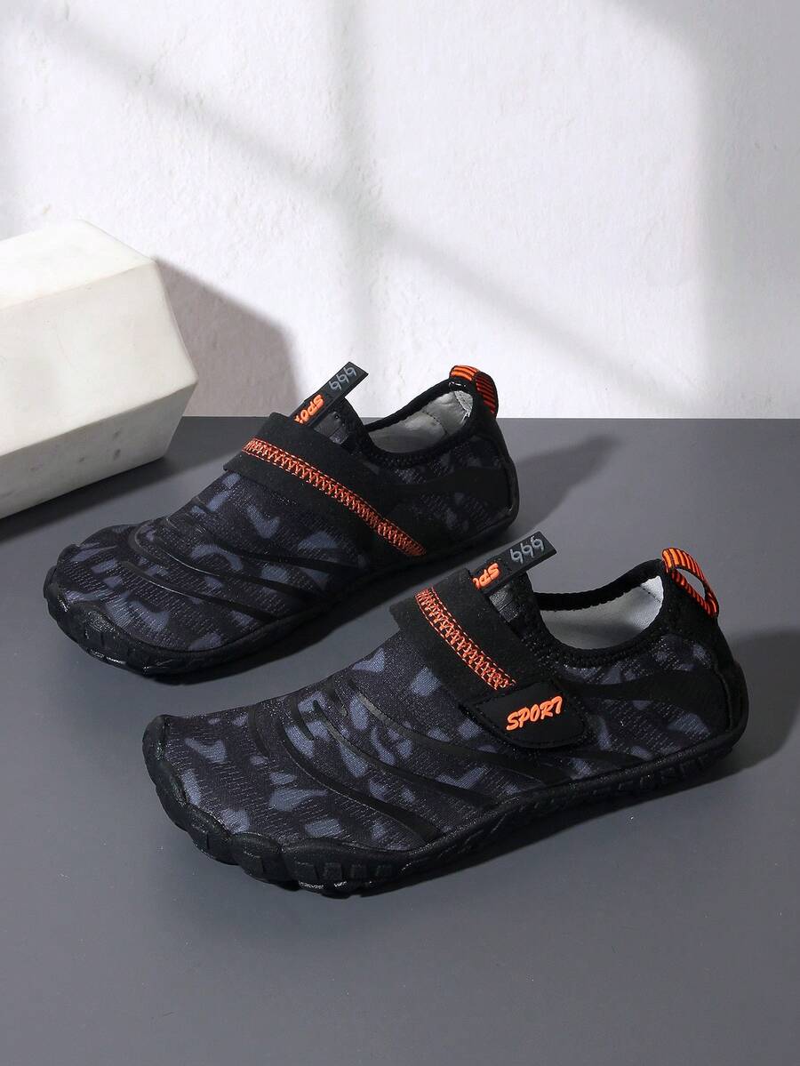 Boys green floral pattern lightweight mesh water shoes with non-slip rubber outsole and hook loop closure.