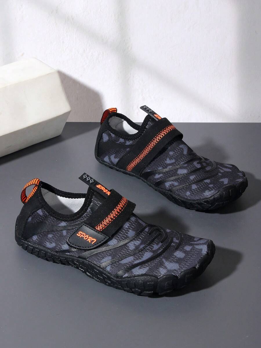 Boys green floral pattern lightweight mesh water shoes with non-slip rubber outsole and hook loop closure.