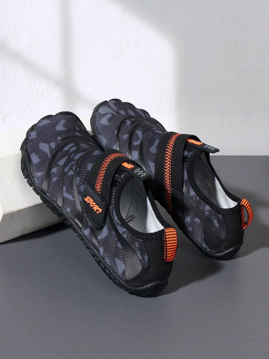 Boys green floral pattern lightweight mesh water shoes with non-slip rubber outsole and hook loop closure.