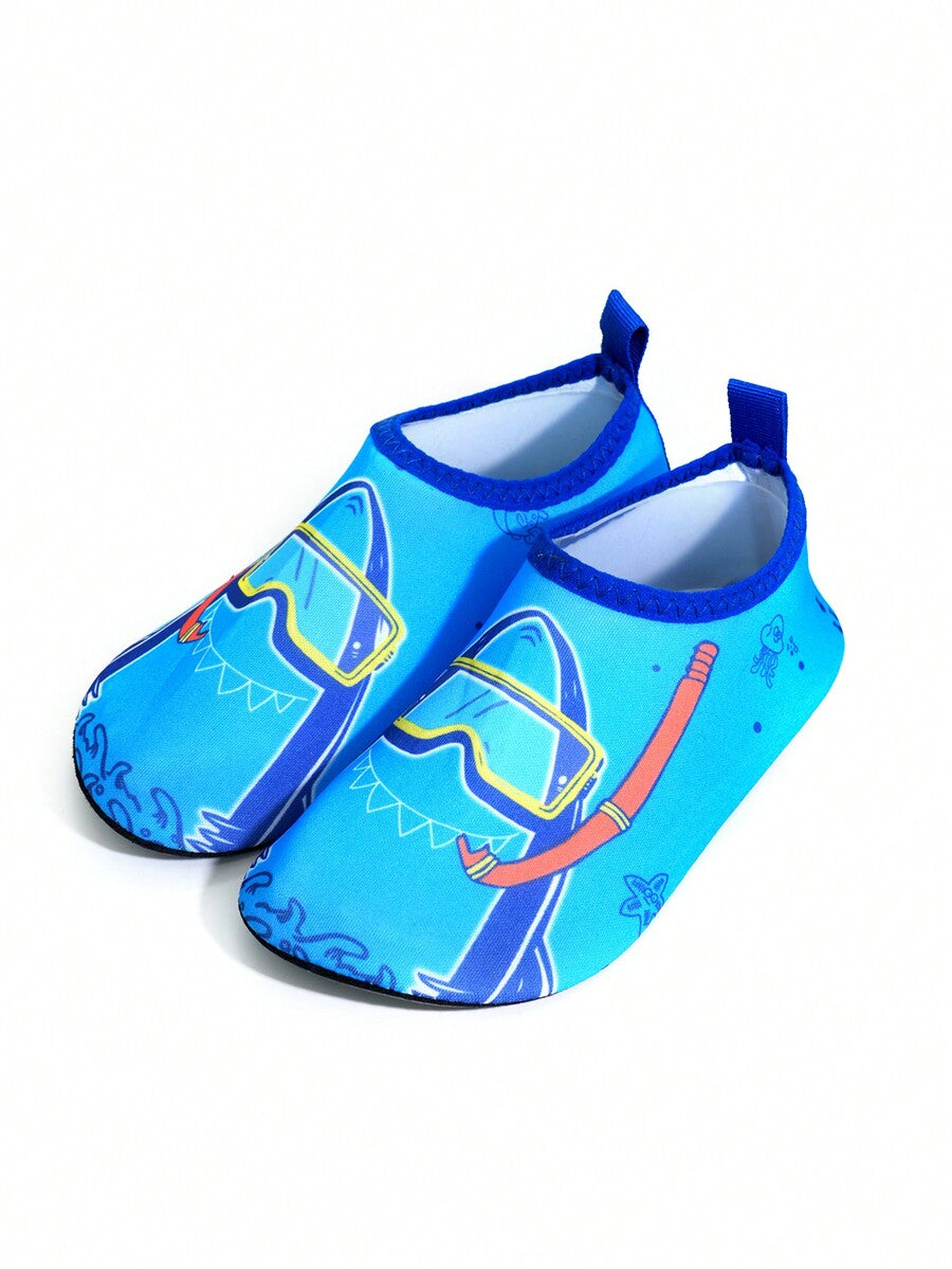 Multicolor cartoon pattern boys' aqua socks with breathable polyester upper, slip-on closure, and non-slip TPR outsole.